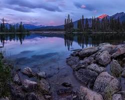 Calm mountain lake at dusk